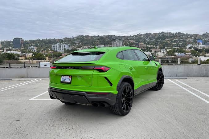 The Bright Green 2021 Lamborghini Urus SUV back view
