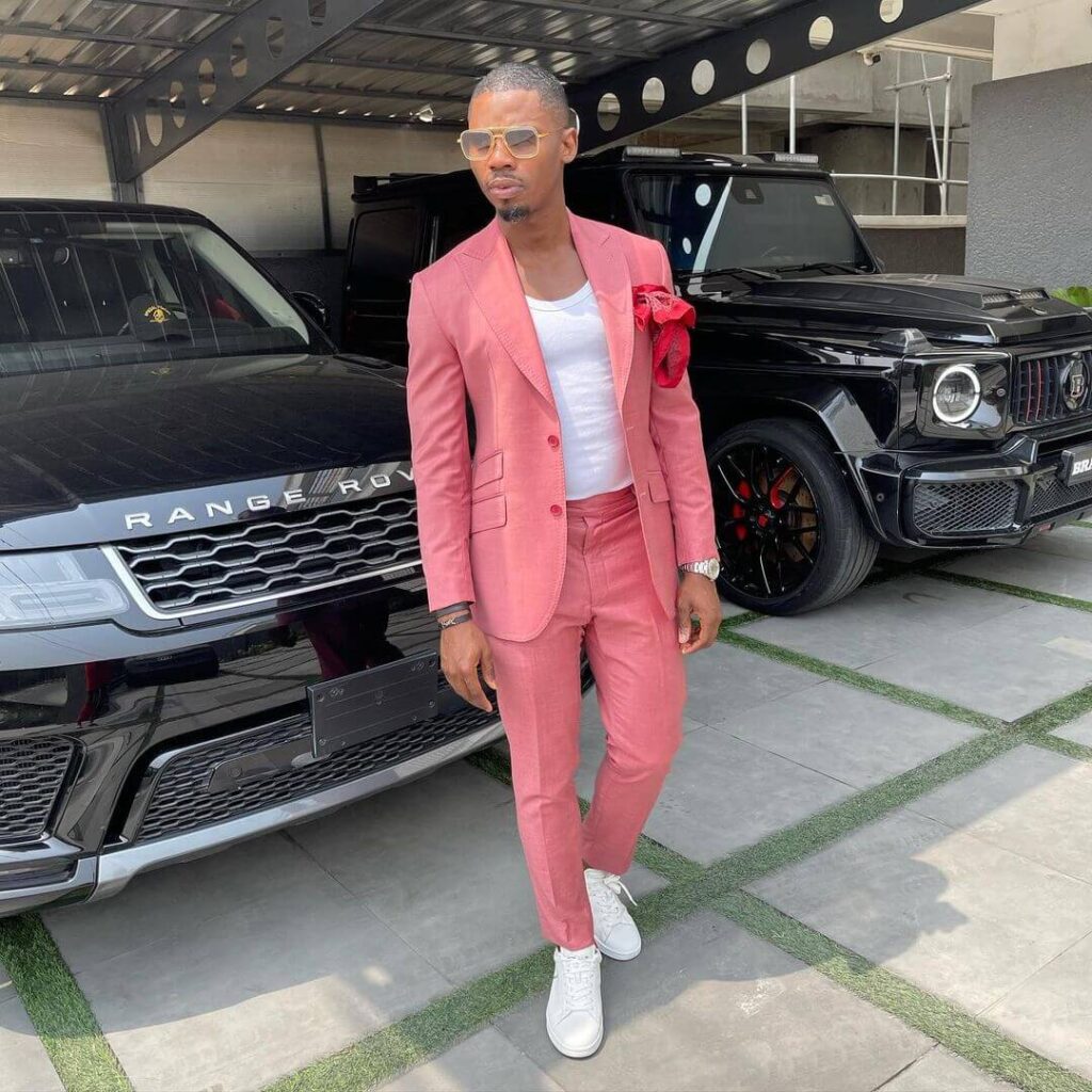 TundeWearsItAll pose with his Range Rover and brabus g wagon