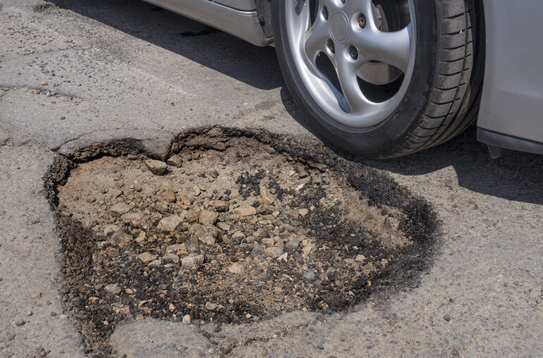 Potholes Damage Cars