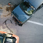 Elevated view of broken cars after accident.