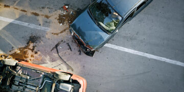 Elevated view of broken cars after accident.