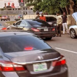 Man Surprised to Find the Rare Mercedes CLS63 AMG, Rushes to Take Pictures of the Luxury Car in Abuja