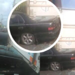 Motorist escapes death as a container from trailer falls on Toyota Camry in Lagos