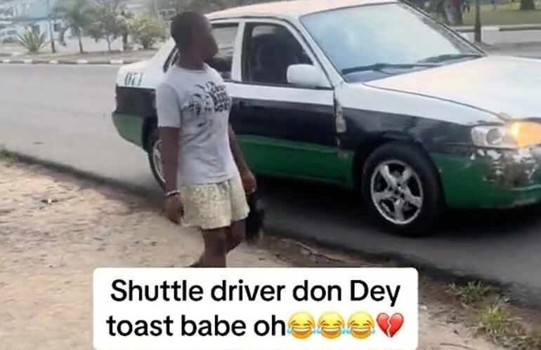 Taxi driver spotted toasting a Babe while on the move