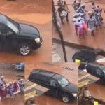 Reaction As Pastor & His Wife Chills Inside SUV Car While Church Members Walk in the Rain