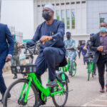 makinde riding bicycle