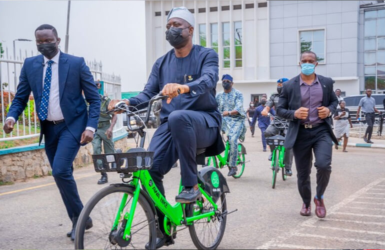 makinde riding bicycle