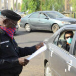 Nigerian Police stopping cars