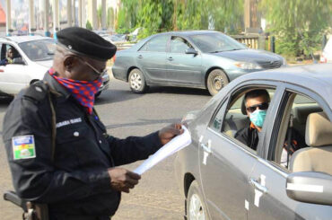 Nigerian Police stopping cars